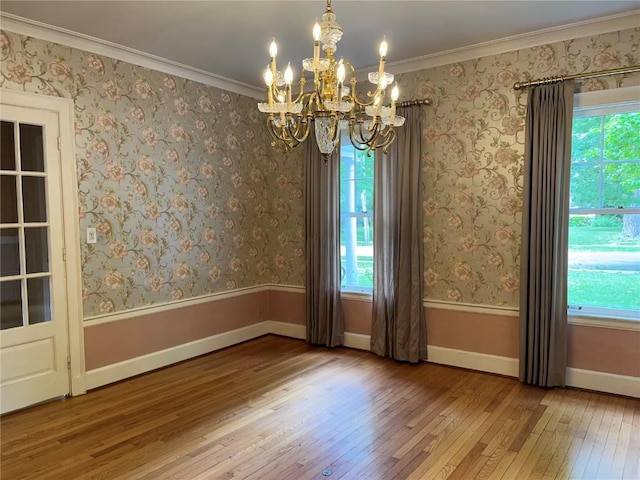 620 S Summit St, Iowa City, IA 52240 - unfurnished room featuring hardwood / wood-style floors, a chandelier, baseboards, and ornamental molding