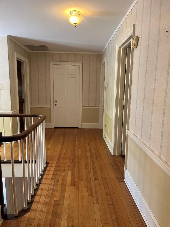 620 S Summit St, Iowa City, IA 52240 - hall featuring wood-type flooring and an upstairs landing