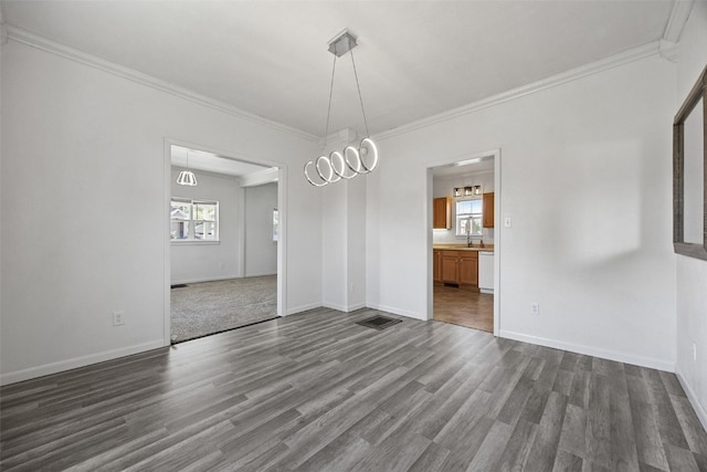 1337 Ellis Blvd NW, Cedar Rapids, IA 52405 - unfurnished dining area featuring dark wood-type flooring, ornamental molding, baseboards, and a sink