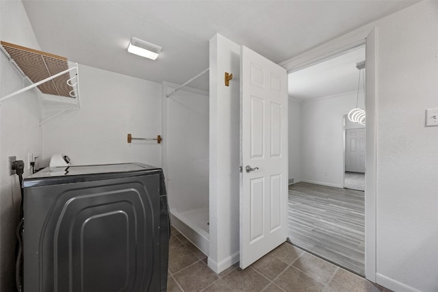 1337 Ellis Blvd NW, Cedar Rapids, IA 52405 - washroom featuring washer / dryer and baseboards