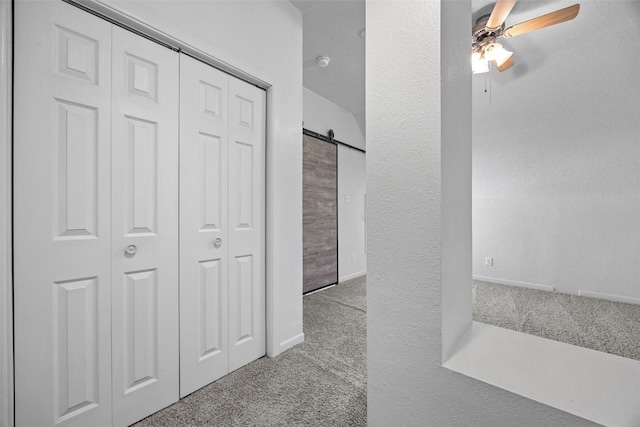 1337 Ellis Blvd NW, Cedar Rapids, IA 52405 - hall with carpet and a barn door