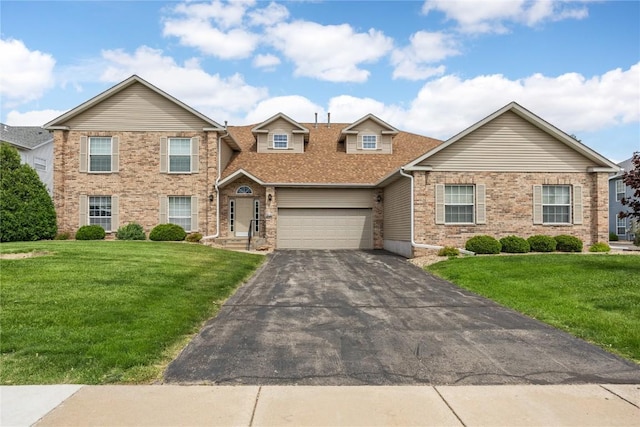 3110 Towne House Dr NE Unit C, Cedar Rapids, IA 52402 - traditional-style home featuring driveway, a front yard, a garage, and roof with shingles