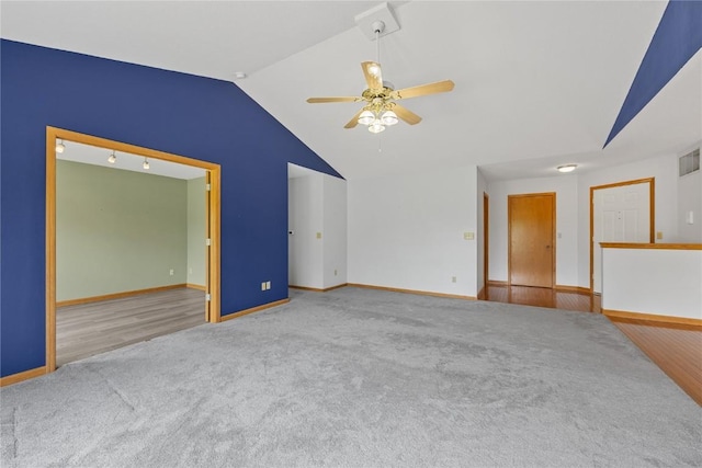 3110 Towne House Dr NE Unit C, Cedar Rapids, IA 52402 - carpeted empty room with vaulted ceiling, ceiling fan, and baseboards