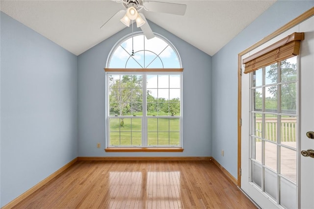 3110 Towne House Dr NE Unit C, Cedar Rapids, IA 52402 - unfurnished room featuring light wood-style flooring, baseboards, vaulted ceiling, and ceiling fan