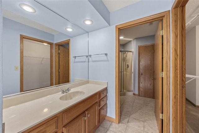 3110 Towne House Dr NE Unit C, Cedar Rapids, IA 52402 - full bath with a shower stall, vanity, baseboards, tile patterned flooring, and recessed lighting