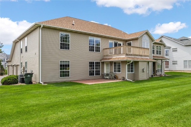 3110 Towne House Dr NE Unit C, Cedar Rapids, IA 52402 - back of house with central AC unit, a lawn, a patio area, and a balcony