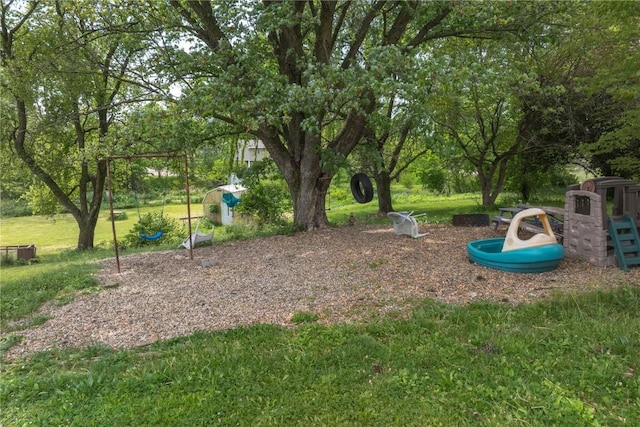 3136 155th St, Muscatine, IA 52761 - surrounding community featuring a playground and a yard
