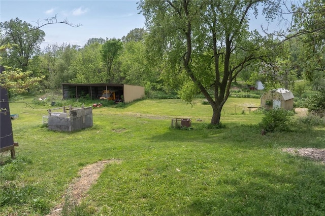 3136 155th St, Muscatine, IA 52761 - view of grassy yard featuring an outbuilding and an outdoor structure