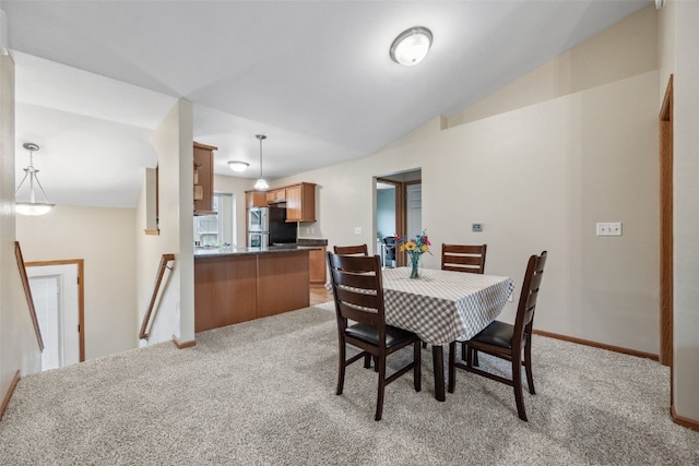 1075 Twilight Dr, North Liberty, IA 52317 - dining space with light carpet, lofted ceiling, and baseboards