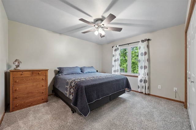 1075 Twilight Dr, North Liberty, IA 52317 - carpeted bedroom featuring baseboards, a ceiling fan, and a closet