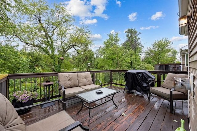 1075 Twilight Dr, North Liberty, IA 52317 - wooden deck with grilling area and an outdoor hangout area