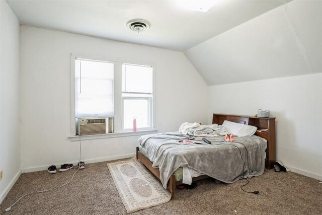 205 2nd Ave, Atkins, IA 52206 - bedroom with vaulted ceiling, carpet floors, cooling unit, and baseboards