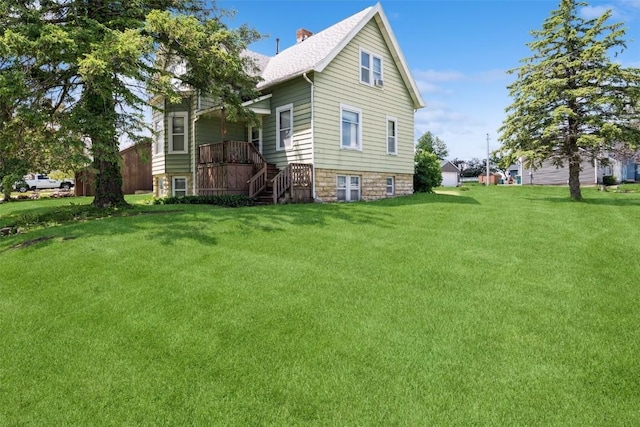 205 2nd Ave, Atkins, IA 52206 - view of home's exterior featuring a lawn and stairway