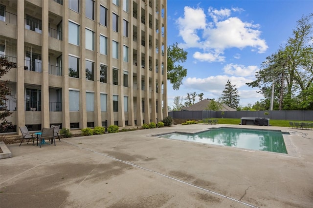 2222 1st Ave NE Unit 107, Cedar Rapids, IA 52402 - view of swimming pool with a patio and a jacuzzi