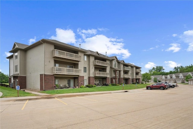 250 Cimarron Unit 311, Hiawatha, IA 52233 - view of building exterior featuring uncovered parking