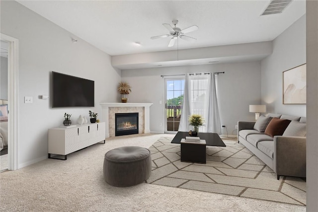 250 Cimarron Unit 311, Hiawatha, IA 52233 - living room featuring ceiling fan, a fireplace with flush hearth, baseboards, and carpet flooring