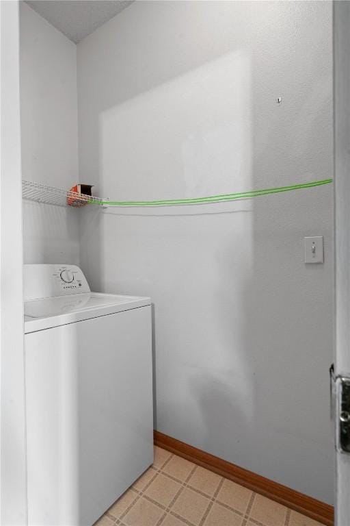 250 Cimarron Unit 311, Hiawatha, IA 52233 - laundry area with washer / dryer and baseboards
