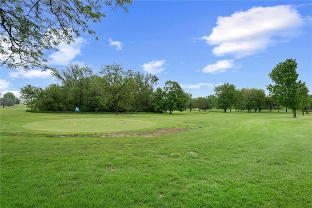 250 Cimarron Unit 311, Hiawatha, IA 52233 - view of home's community with a putting green, view of golf course, a yard, and view of scattered trees