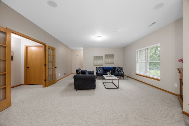959 Tamarack Trl, Iowa City, IA 52245 - carpeted living room with baseboards and french doors