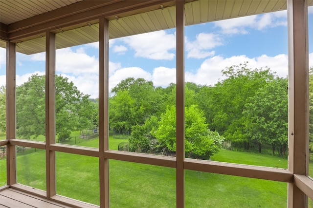 959 Tamarack Trl, Iowa City, IA 52245 - unfurnished sunroom featuring view of wooded area
