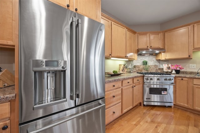959 Tamarack Trl, Iowa City, IA 52245 - kitchen with appliances with stainless steel finishes, under cabinet range hood, and light brown cabinets