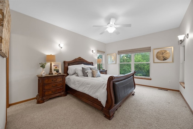959 Tamarack Trl, Iowa City, IA 52245 - bedroom with baseboards, light colored carpet, and ceiling fan