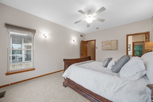 959 Tamarack Trl, Iowa City, IA 52245 - carpeted bedroom with baseboards and a ceiling fan