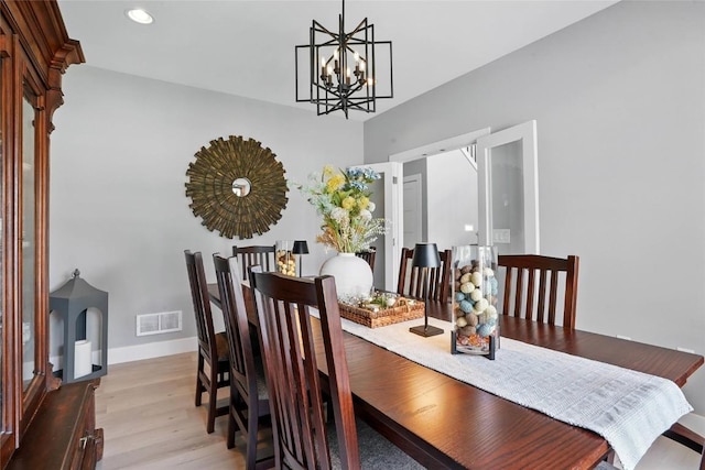 2925 Pine Hill Trce, Coralville, IA 52241 - dining space with a chandelier, light wood-style flooring, baseboards, and recessed lighting