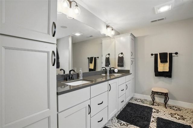 2925 Pine Hill Trce, Coralville, IA 52241 - full bathroom featuring baseboards and double vanity