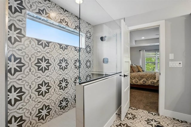 2925 Pine Hill Trce, Coralville, IA 52241 - ensuite bathroom featuring a walk in shower and baseboards