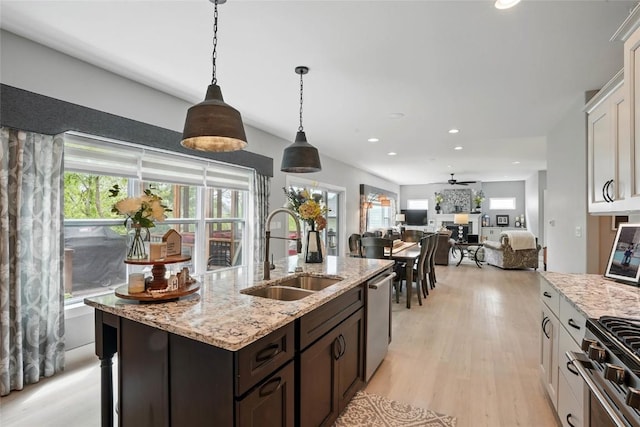 2925 Pine Hill Trce, Coralville, IA 52241 - kitchen featuring a sink, stainless steel appliances, plenty of natural light, white cabinets, and recessed lighting