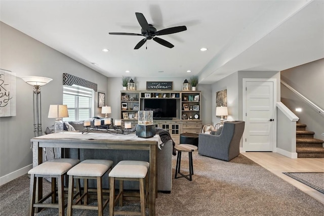 2925 Pine Hill Trce, Coralville, IA 52241 - living room featuring stairway, carpet, baseboards, a ceiling fan, and recessed lighting