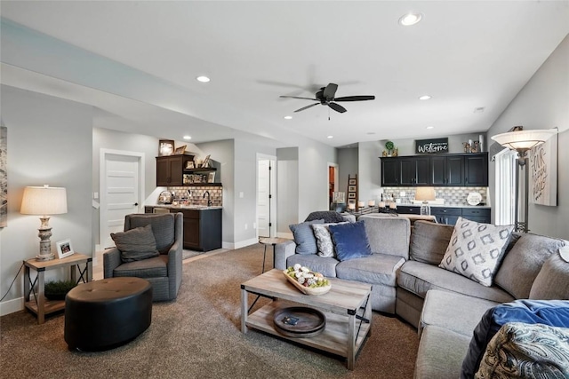 2925 Pine Hill Trce, Coralville, IA 52241 - living room featuring light carpet, baseboards, a ceiling fan, recessed lighting, and bar