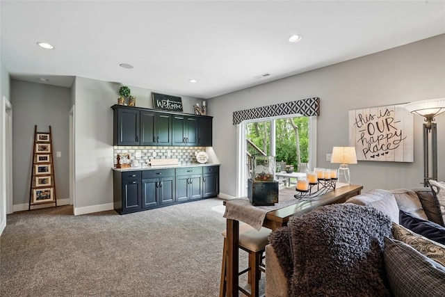 2925 Pine Hill Trce, Coralville, IA 52241 - living area with light carpet, baseboards, and recessed lighting