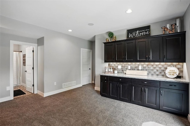 2925 Pine Hill Trce, Coralville, IA 52241 - bar area featuring carpet flooring, backsplash, recessed lighting, and baseboards