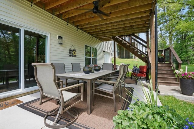 2925 Pine Hill Trce, Coralville, IA 52241 - view of patio featuring stairs, outdoor dining space, and a ceiling fan