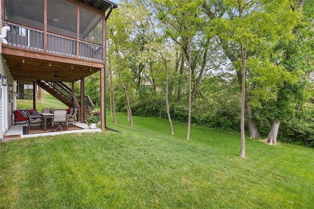 2925 Pine Hill Trce, Coralville, IA 52241 - view of green lawn with a patio, stairs, and a sunroom