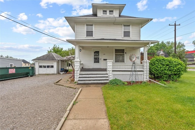 100 E Welsh St, Williamsburg, IA 52361 - traditional style home featuring covered porch, a front yard, a garage, and gravel driveway
