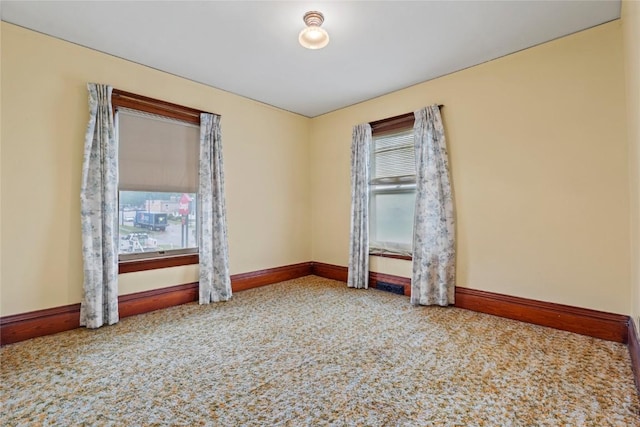 100 E Welsh St, Williamsburg, IA 52361 - carpeted empty room with baseboards