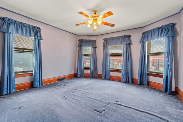 100 E Welsh St, Williamsburg, IA 52361 - spare room featuring carpet, baseboards, and ceiling fan