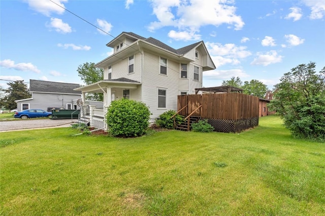 100 E Welsh St, Williamsburg, IA 52361 - rear view of house with a lawn