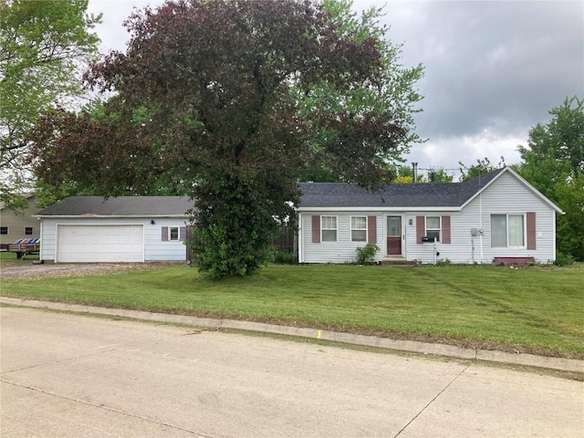 1403 W 3rd St, Vinton, IA 52349 - ranch-style house with a front lawn, a garage, and driveway