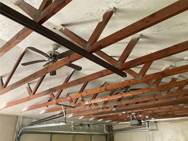 1403 W 3rd St, Vinton, IA 52349 - garage view of a garage door opener and beamed ceiling