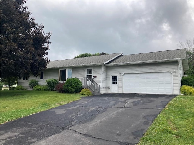 202 S 9th Ave, Vinton, IA 52349 - ranch-style home with a garage, driveway, and a front yard