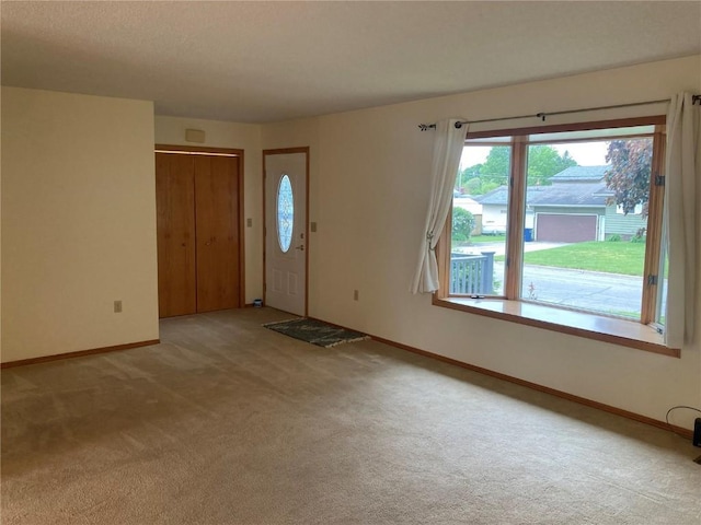 202 S 9th Ave, Vinton, IA 52349 - entrance foyer with light carpet and baseboards