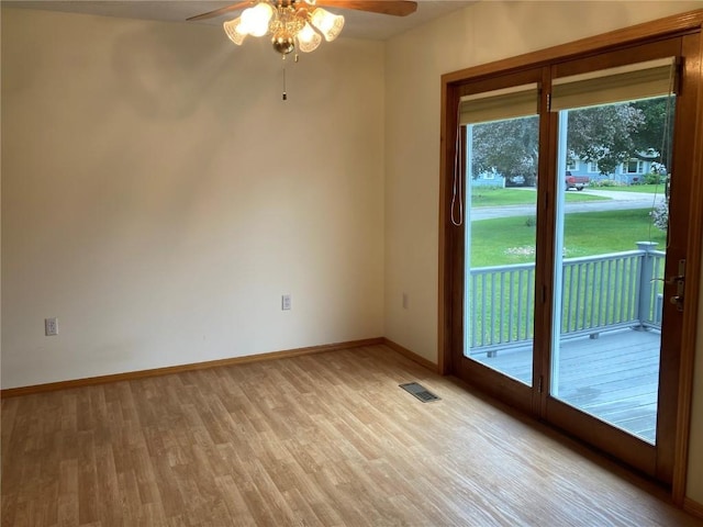 202 S 9th Ave, Vinton, IA 52349 - spare room with ceiling fan, light wood-style flooring, and baseboards