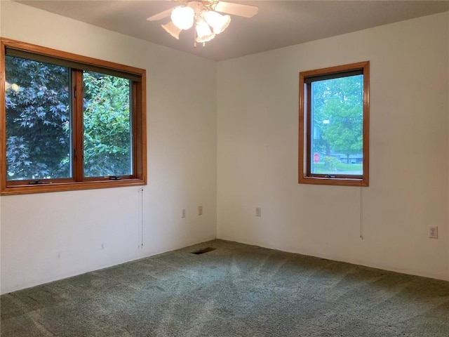 202 S 9th Ave, Vinton, IA 52349 - carpeted empty room featuring a ceiling fan