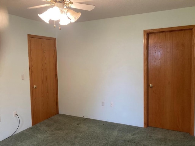 202 S 9th Ave, Vinton, IA 52349 - carpeted empty room with ceiling fan