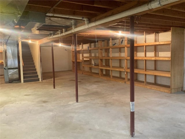 202 S 9th Ave, Vinton, IA 52349 - unfinished basement featuring stairway and heating unit