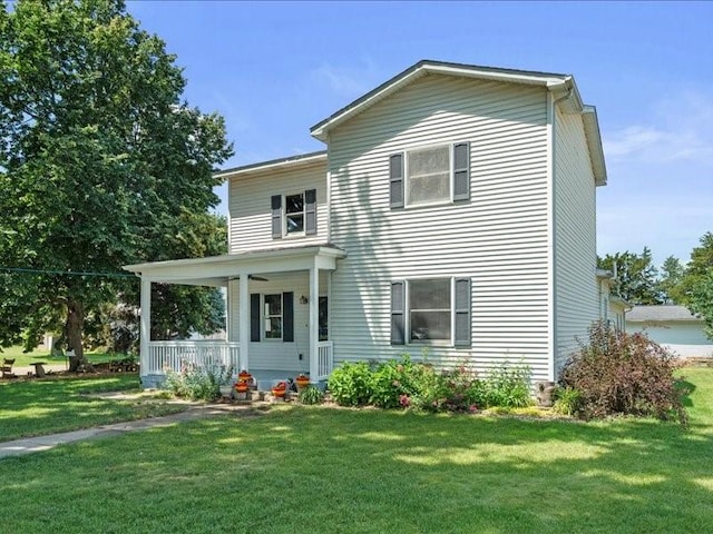 433 S Iowa St, Solon, IA 52333 - view of front of property with a porch and a front lawn